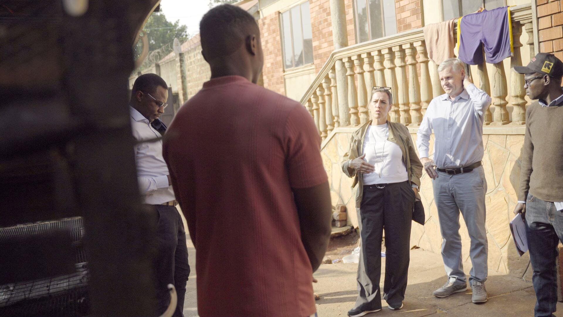 The IKEA Foundation CEO, Jessica Anderen(center) interacts with Jonathan Fama an IRC client who received a business grant under Re:BUiLD