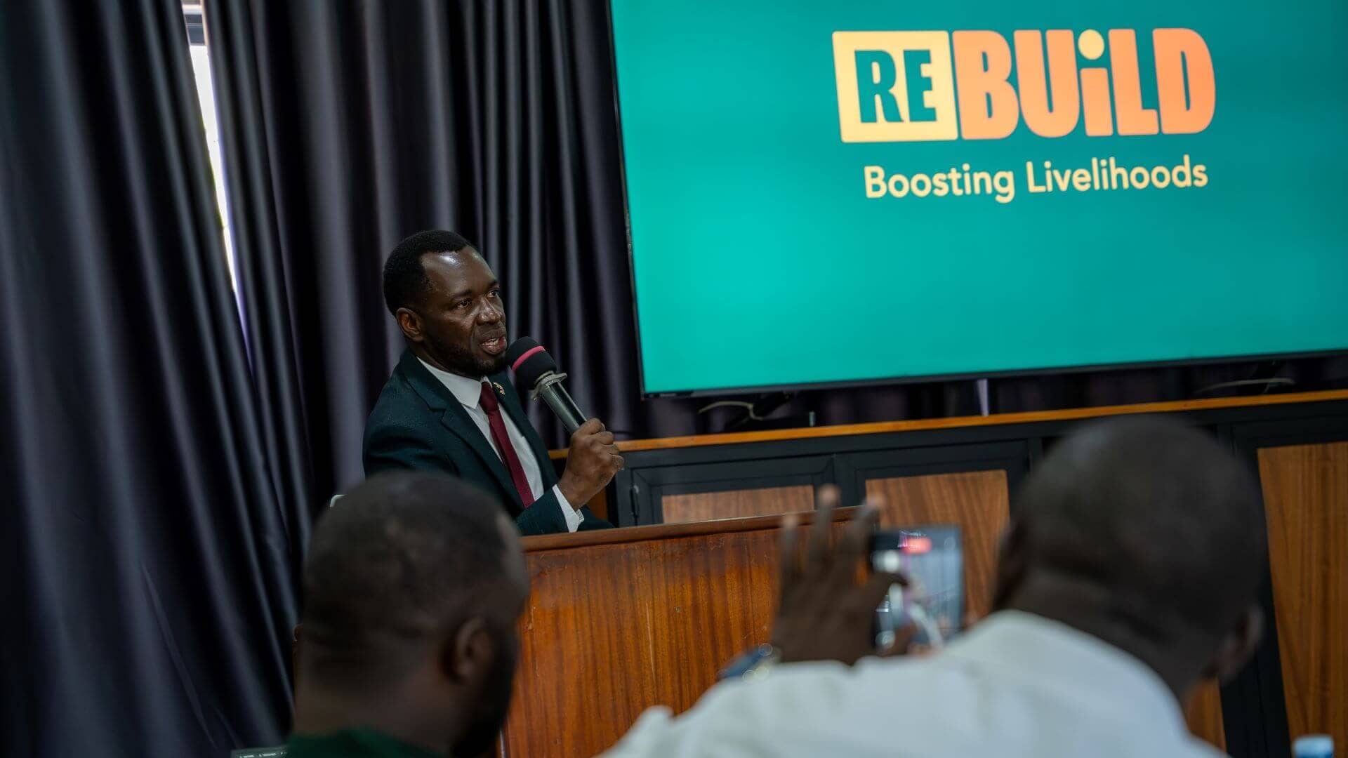 His Worship Bukeni Ali, Mayor of Nakawa Division, addresses participants during the Re:BUiLD stakeholder engagement, calling for empathy, inclusion, and equal access to services for refugees and host communities under the spirit of Ubuntu.