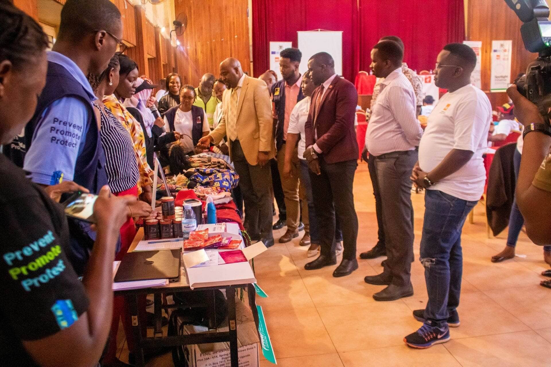 December 10, 2024, Kampala, Uganda. Commissioner Equity and Rights, MoGLSD, Benard Mujuni inspects products on display during celebrations to mark Human Rights Day at Pope Paul Memorial Hotel in Rubaga, Kampala. (PHOTO: Edna Karyne Kyokunzire for The IRC)