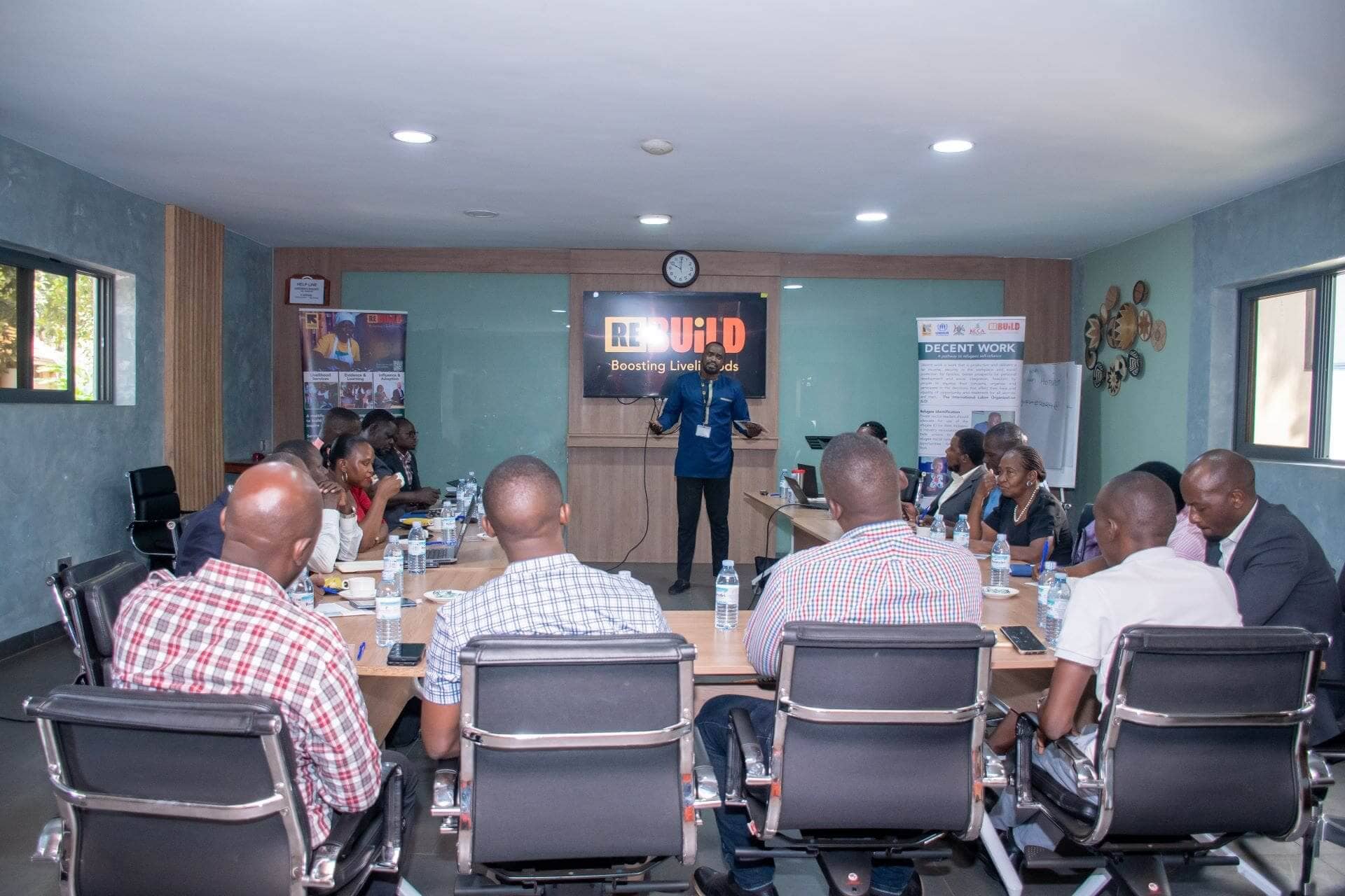 Moses Okot the Re:BUiLD Adocacy Manager facilitating a session on the Legal Frame Work for refugees