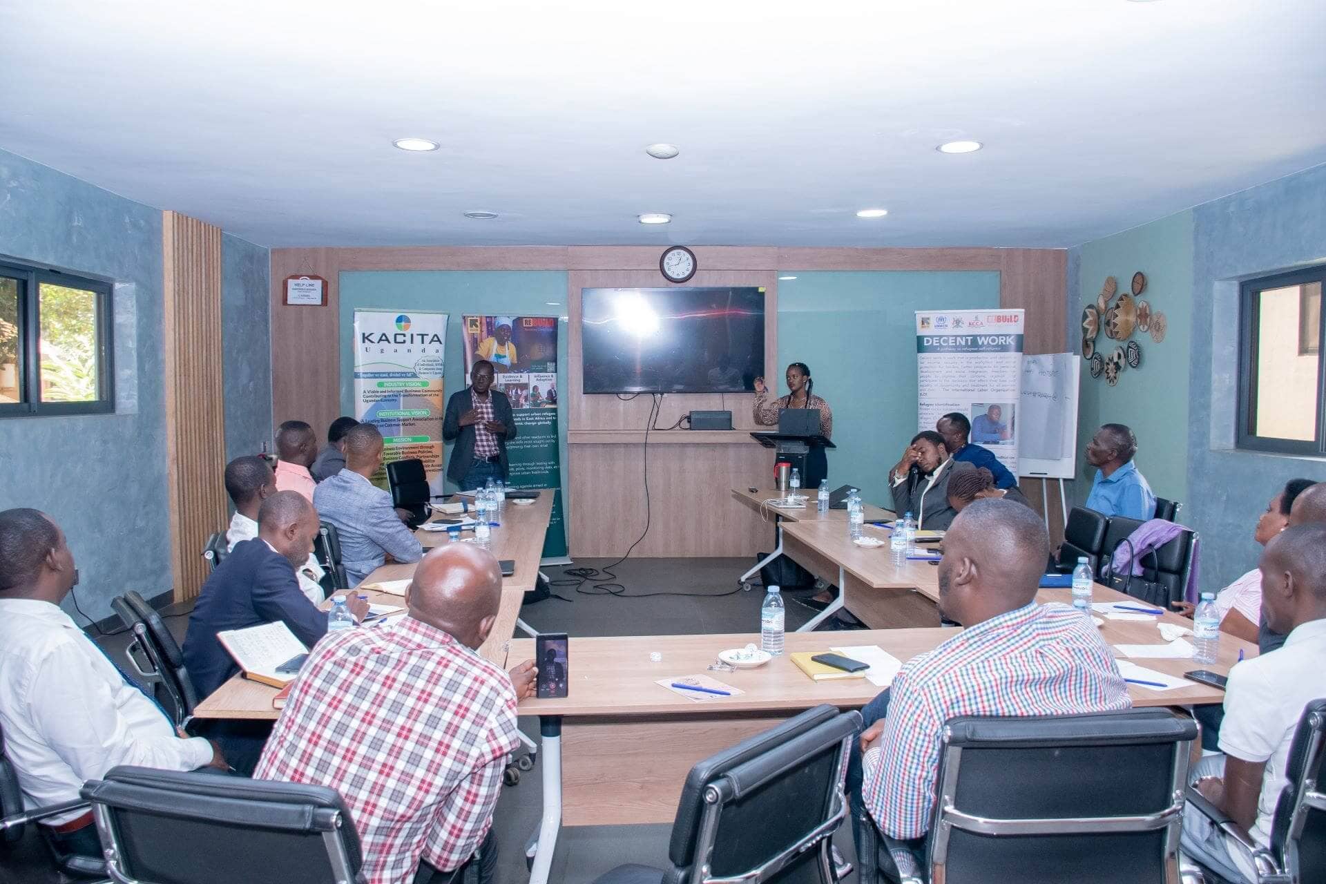 Moses Odokonyero, Re:BUiLD Senior Program Manager for Uganda and Agnes Baseera an official from the Office of the Prime Minister (Uganda) responding to queries from KACITA Board Members.