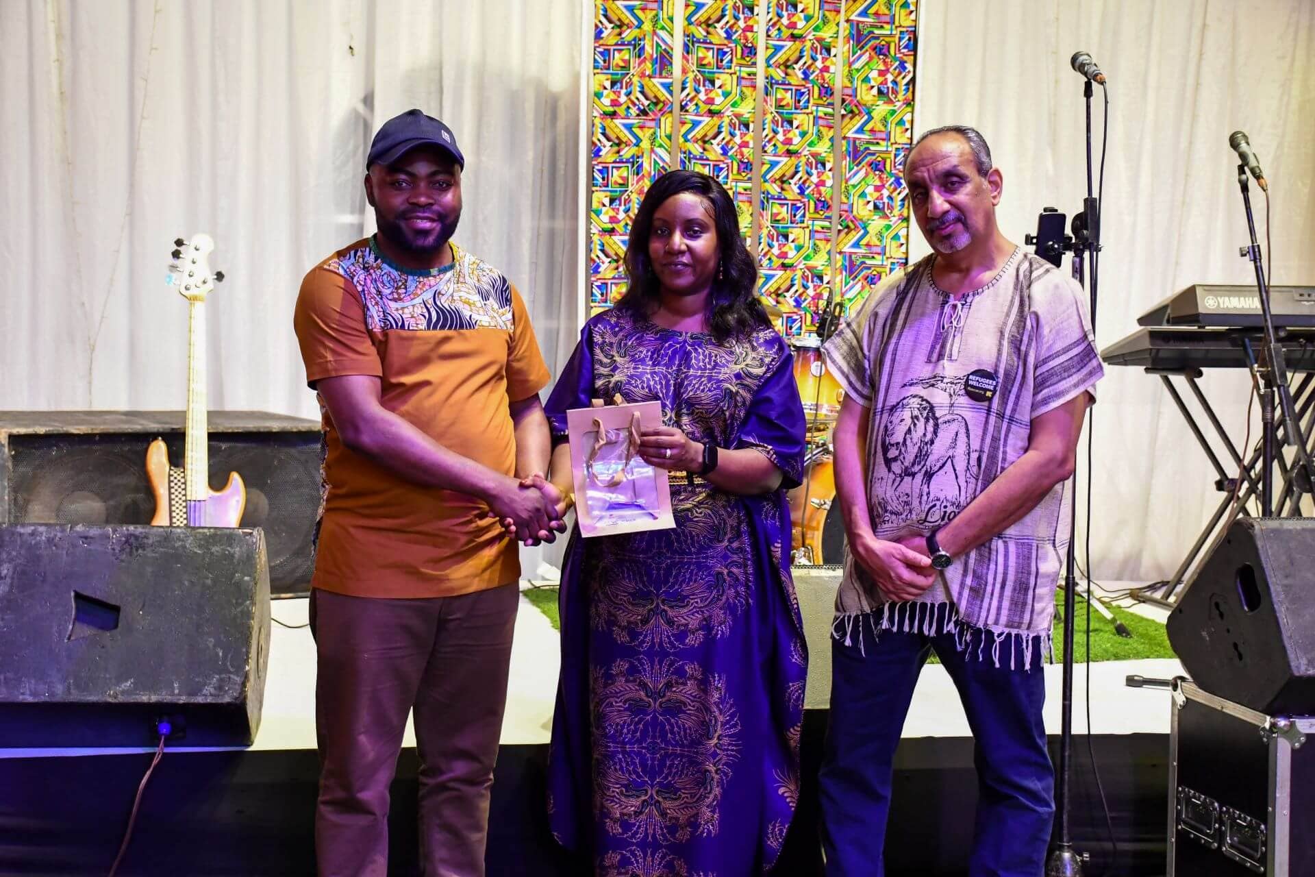 IRC’s Joyce Mogane and Mohammed El Montassir present a gift to a Re:BUiLD partner at the Gala Dinner later in the evening