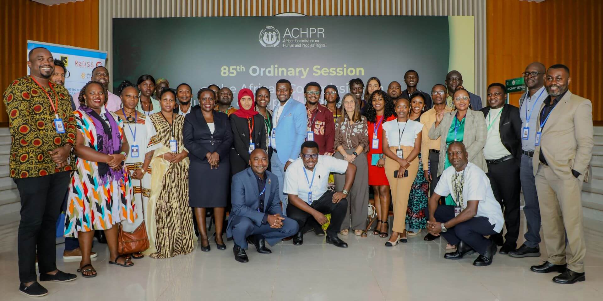 Participants of the side event pose for a group photo with Hon. Commissioner Selma Sassi-Safer of the ACHPR during the 85th ACHPR Session in Banjul, The Gambia