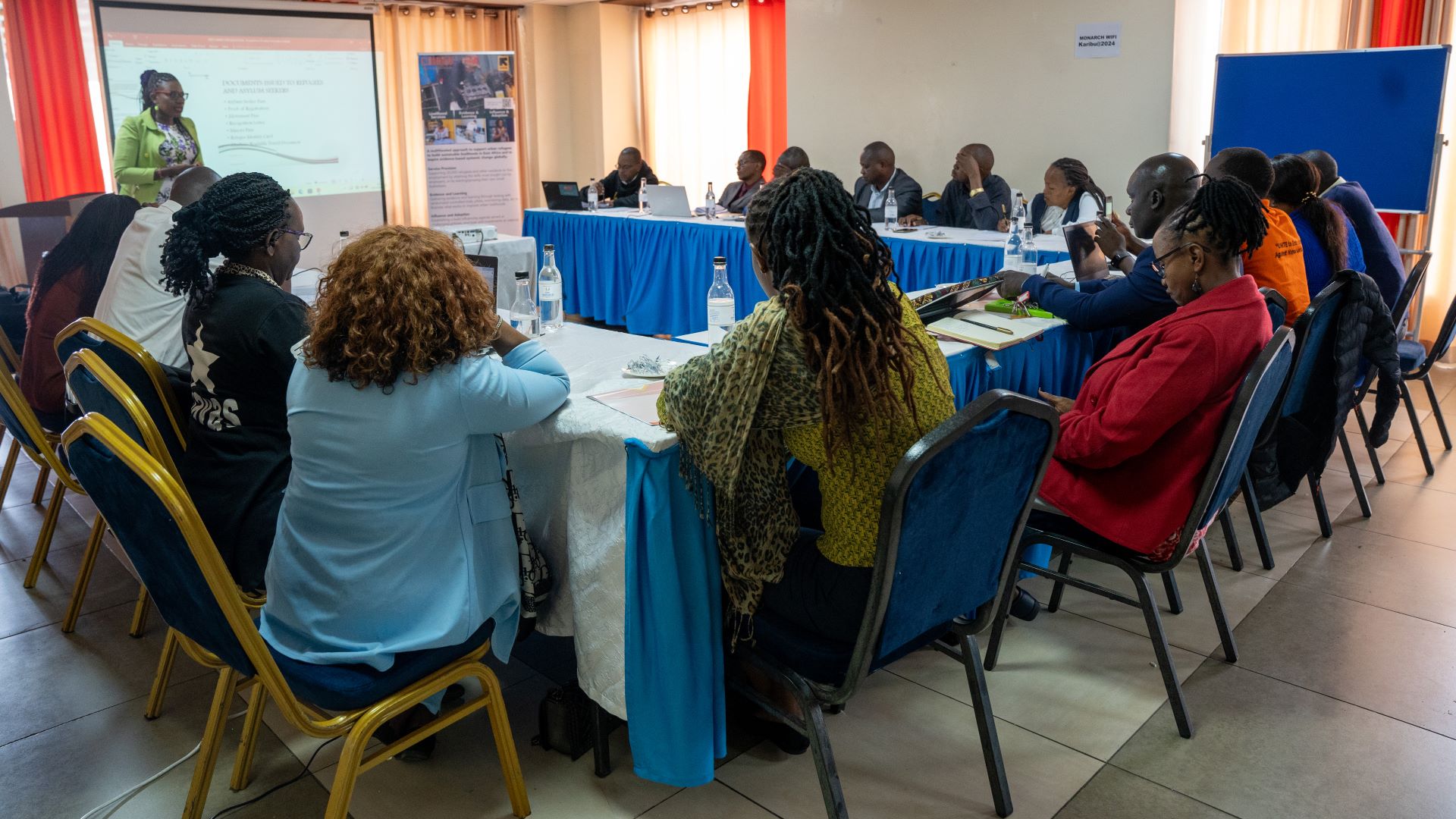 December 4, 2024, Nairobi. Damarice Otieno from the Department of Refugee Service making her presentation during the 12th Stakeholder Reference Group Meeting (SRGM). (PHOTO: Nancy Mwangi for The IRC)