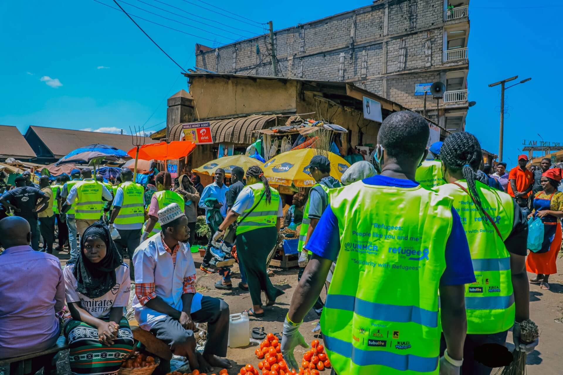 Re:BUiLD staff and partners take part in cleaning Owino market in commemoration of World Refugee Day