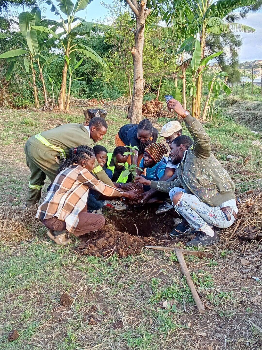 World Environment Day participants plant a tree to support carbon capture and urban greening at Gatharaini